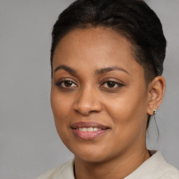 Joyful black young-adult female with medium  brown hair and brown eyes