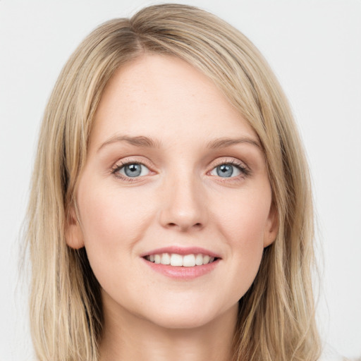 Joyful white young-adult female with long  brown hair and blue eyes