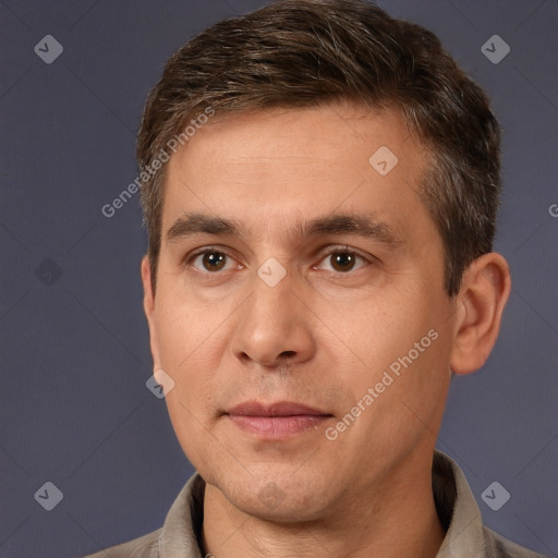 Joyful white adult male with short  brown hair and brown eyes