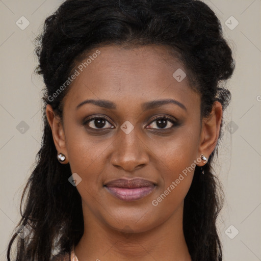 Joyful black young-adult female with long  black hair and brown eyes