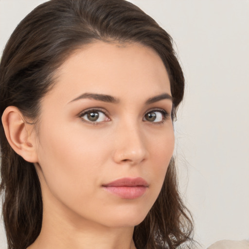 Neutral white young-adult female with medium  brown hair and brown eyes