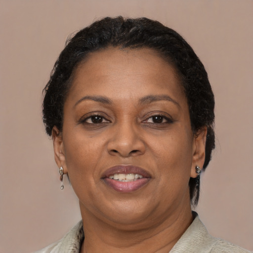 Joyful latino adult female with short  brown hair and brown eyes