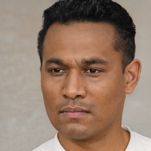 Neutral latino young-adult male with short  black hair and brown eyes
