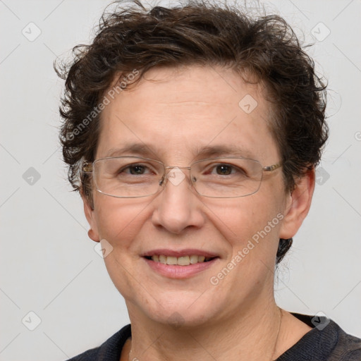 Joyful white adult female with short  brown hair and grey eyes