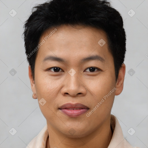 Joyful asian young-adult male with short  brown hair and brown eyes