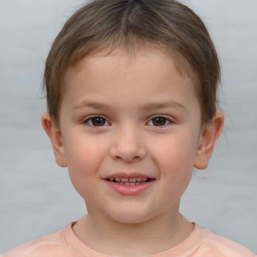 Joyful white child female with short  brown hair and brown eyes