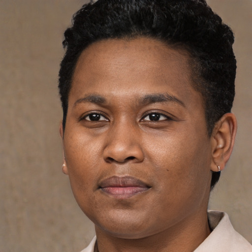Joyful black young-adult male with short  brown hair and brown eyes