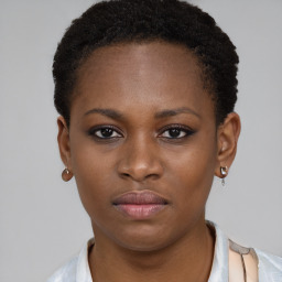 Neutral black young-adult female with short  brown hair and brown eyes