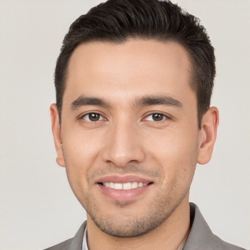 Joyful white young-adult male with short  brown hair and brown eyes