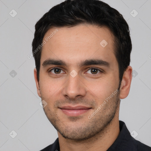 Joyful white young-adult male with short  black hair and brown eyes