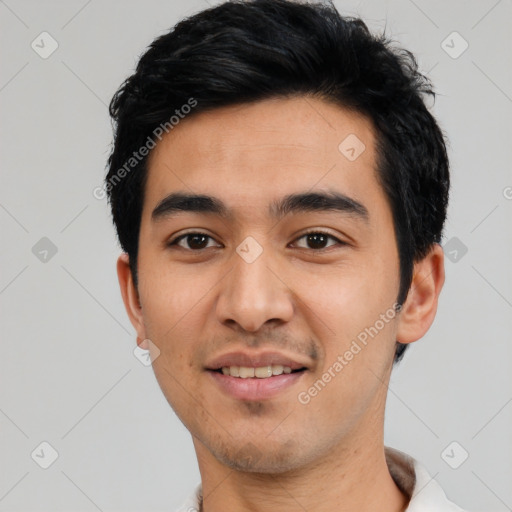 Joyful latino young-adult male with short  black hair and brown eyes