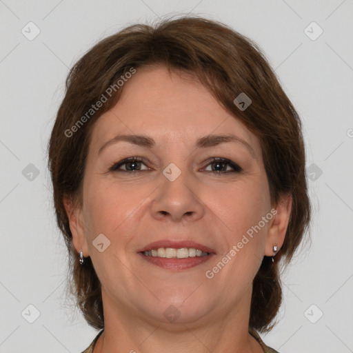 Joyful white adult female with medium  brown hair and brown eyes