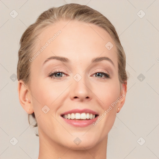 Joyful white young-adult female with medium  brown hair and blue eyes