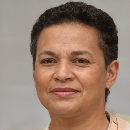 Joyful white adult female with short  brown hair and brown eyes