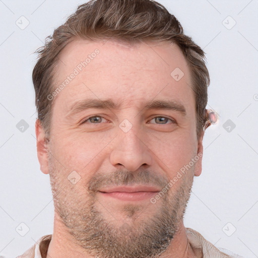 Joyful white adult male with short  brown hair and grey eyes