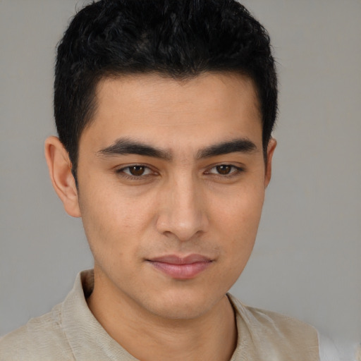 Joyful asian young-adult male with short  brown hair and brown eyes