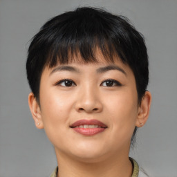 Joyful asian young-adult female with short  brown hair and brown eyes