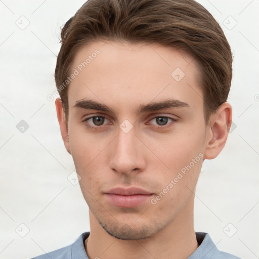 Neutral white young-adult male with short  brown hair and brown eyes