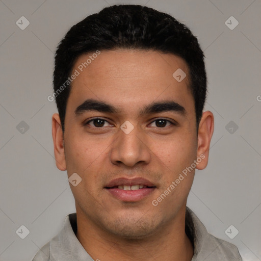 Joyful white young-adult male with short  black hair and brown eyes