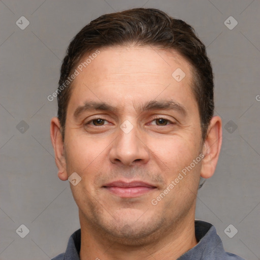 Joyful white adult male with short  brown hair and brown eyes