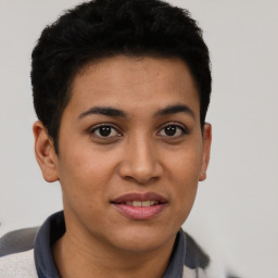 Joyful latino young-adult female with short  brown hair and brown eyes