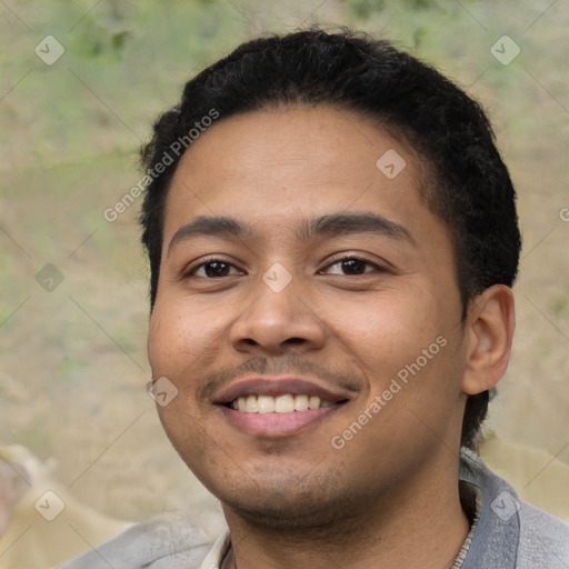 Joyful latino young-adult male with short  black hair and brown eyes