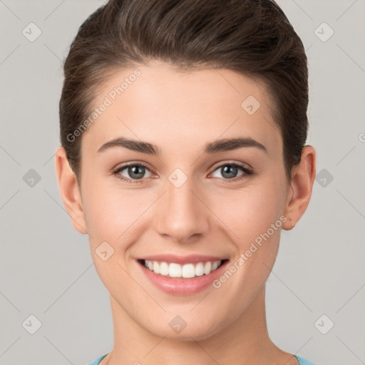 Joyful white young-adult female with short  brown hair and brown eyes