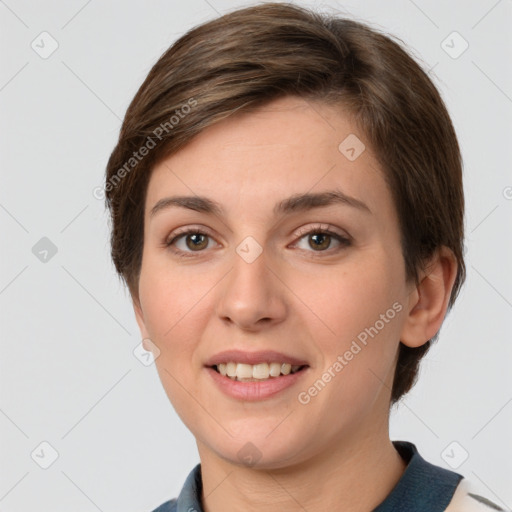 Joyful white young-adult female with short  brown hair and grey eyes