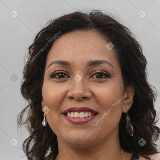 Joyful white adult female with long  brown hair and brown eyes