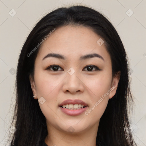 Joyful asian young-adult female with long  black hair and brown eyes