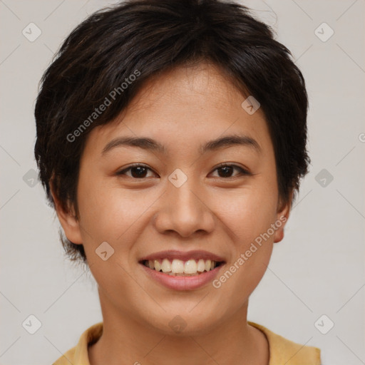 Joyful asian young-adult female with short  brown hair and brown eyes