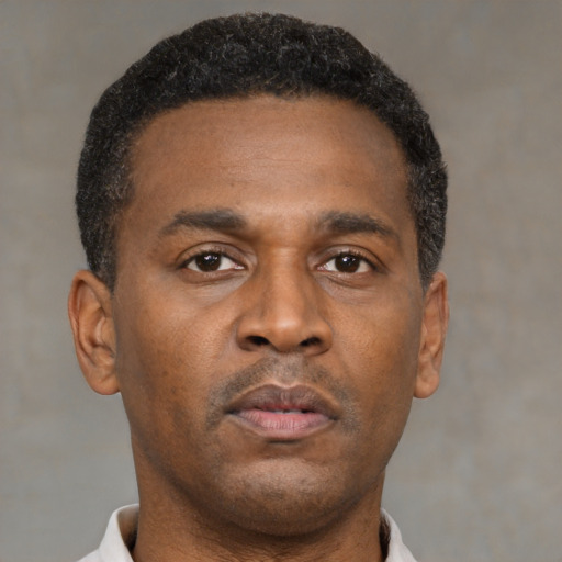 Neutral black young-adult male with short  brown hair and brown eyes