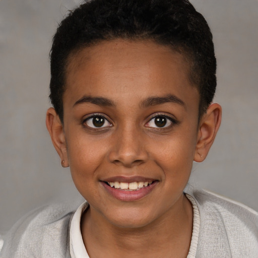 Joyful black child female with short  brown hair and brown eyes