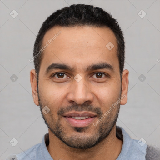 Joyful white young-adult male with short  black hair and brown eyes