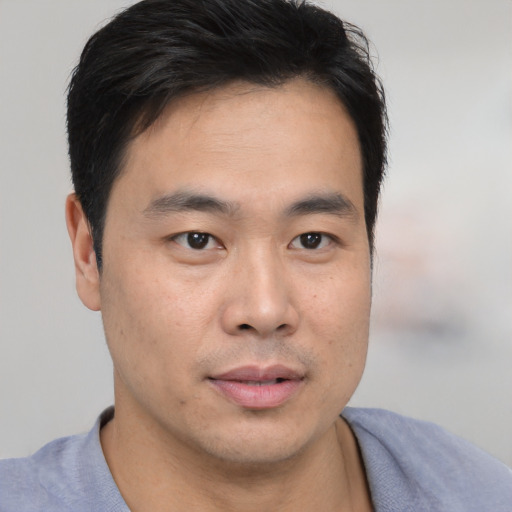 Neutral asian young-adult male with short  brown hair and brown eyes