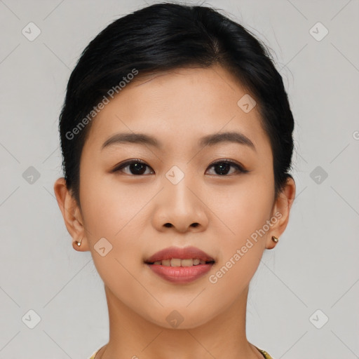 Joyful asian young-adult female with short  black hair and brown eyes