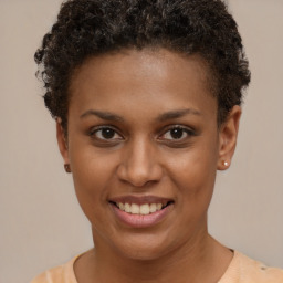 Joyful black young-adult female with short  brown hair and brown eyes