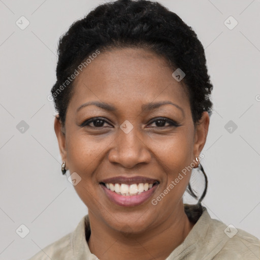 Joyful black young-adult female with short  brown hair and brown eyes