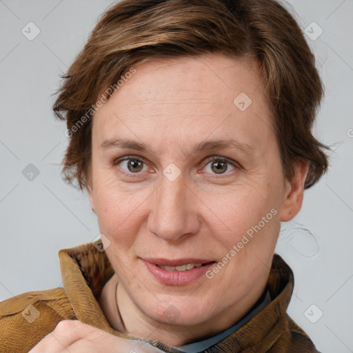 Joyful white adult female with short  brown hair and brown eyes