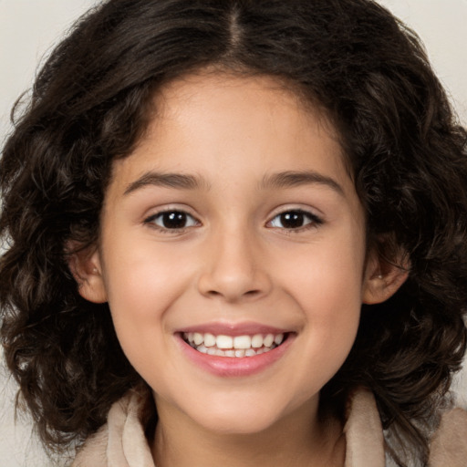 Joyful white child female with long  brown hair and brown eyes