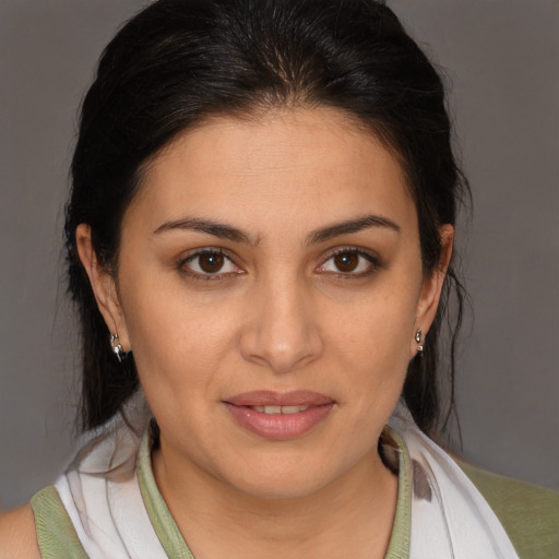 Joyful white young-adult female with medium  brown hair and brown eyes