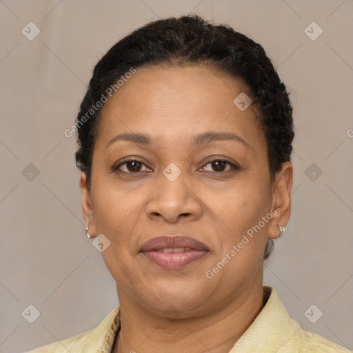 Joyful latino adult female with short  brown hair and brown eyes