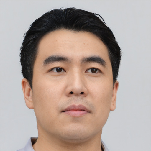 Neutral asian young-adult male with short  black hair and brown eyes