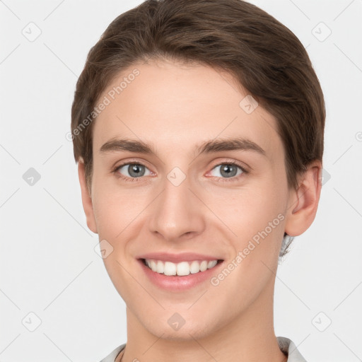 Joyful white young-adult female with short  brown hair and grey eyes