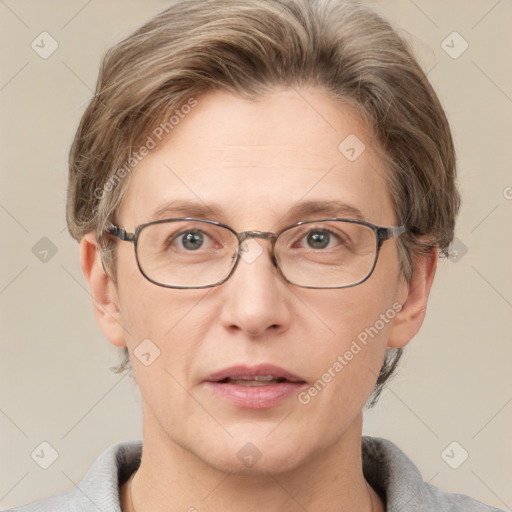 Joyful white adult male with short  brown hair and grey eyes