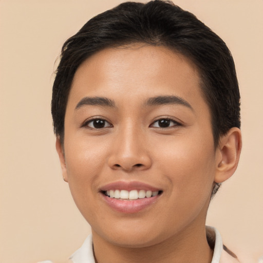 Joyful asian young-adult female with short  brown hair and brown eyes