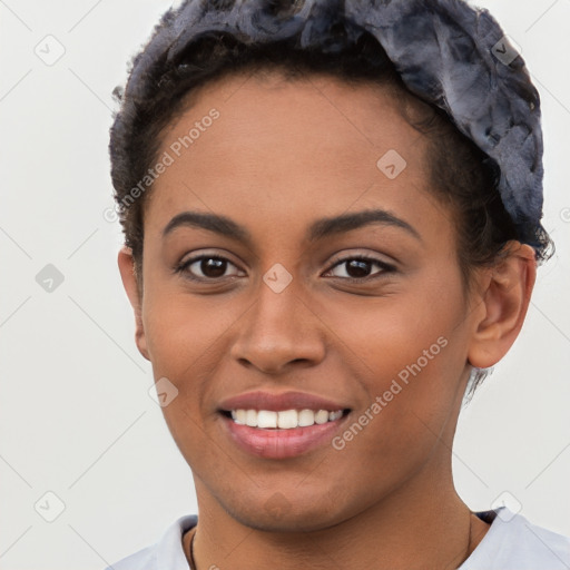 Joyful latino young-adult female with short  brown hair and brown eyes