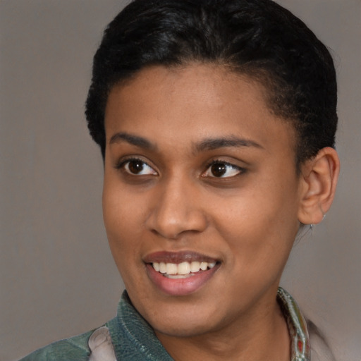 Joyful latino young-adult female with short  brown hair and brown eyes