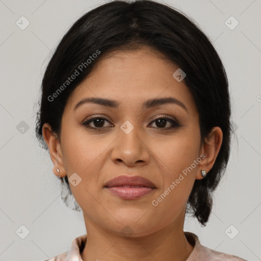 Joyful latino young-adult female with medium  brown hair and brown eyes