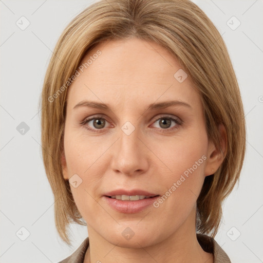 Joyful white adult female with medium  brown hair and grey eyes